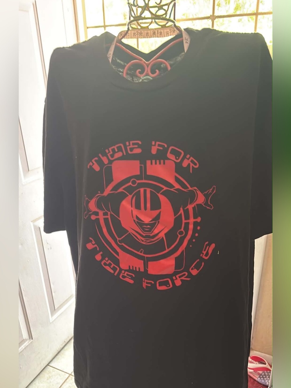 Graphic Black Tee with Red 'Time For Time Forces' Print